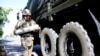 KAZAKHSTAN -- A soldier carries a mortar during an operation of demining the city of Arys, in the aftermath of the explosion at an ammunition depot, June 26, 2019