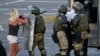 BELARUS -- Belarusian law enforcement officers detain a participant in a protest against the results of the 2020 Belarusian presidential election, in Minsk, August 11, 2020